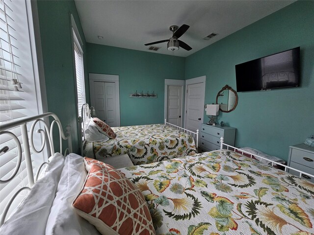 833 Kahla Dr, Crystal Beach, TX 77650 - bedroom with a closet and ceiling fan