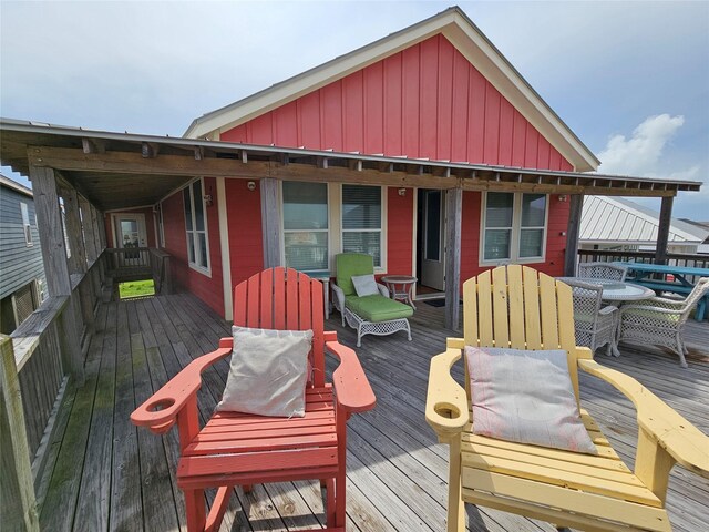 833 Kahla Dr, Crystal Beach, TX 77650 - wooden deck featuring outdoor dining area