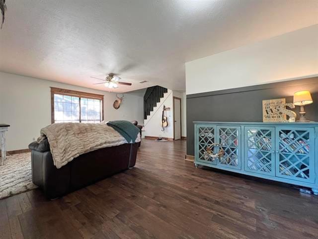 880 E Tram Rd, Vidor, TX 77662 - bedroom with dark wood-style flooring, a ceiling fan, and baseboards