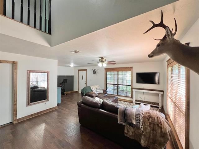 880 E Tram Rd, Vidor, TX 77662 - living room featuring a ceiling fan, wood finished floors, and baseboards