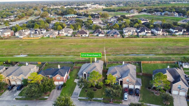 1214 Riverchase Dr, Richmond, TX 77469 - aerial view of property's location with nearby suburban area and a nearby body of water
