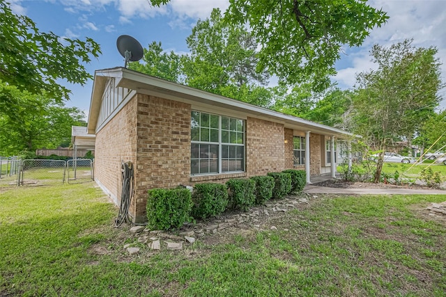 210 N Shirley Ln, Willis, TX 77378 - view of front facade with brick siding