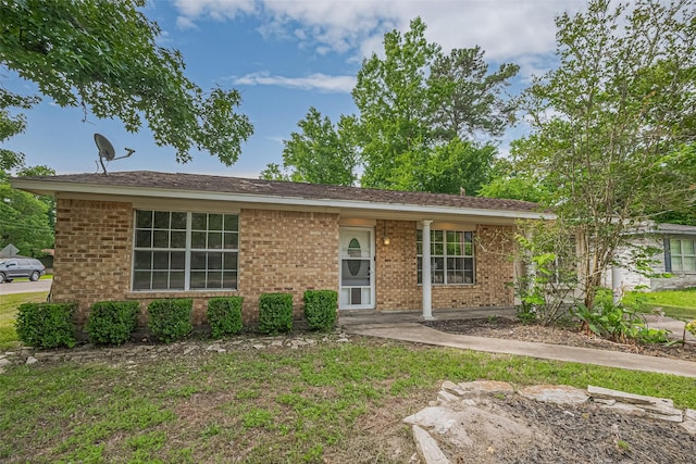 210 N Shirley Ln, Willis, TX 77378 - ranch-style house with brick siding and a front yard