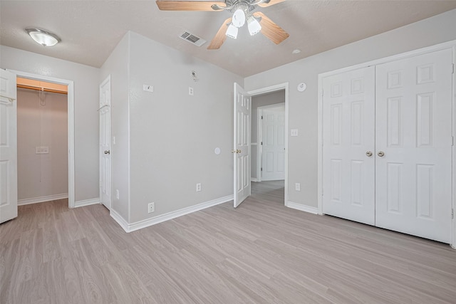 210 N Shirley Ln, Willis, TX 77378 - unfurnished bedroom featuring light wood finished floors, a closet, and baseboards