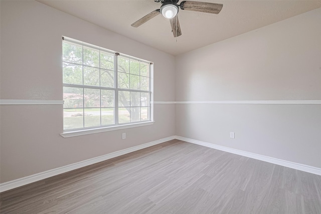 210 N Shirley Ln, Willis, TX 77378 - spare room with wood finished floors, baseboards, and ceiling fan