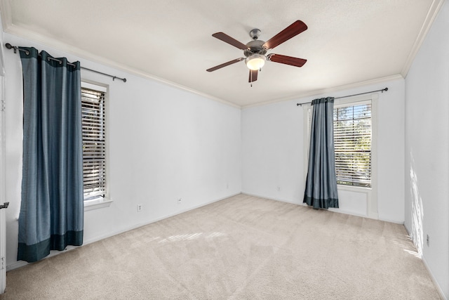 2700 Revere St Unit 138, Houston, TX 77098 - empty room featuring crown molding, carpet flooring, a ceiling fan, and baseboards