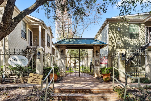 2700 Revere St Unit 138, Houston, TX 77098 - view of property's community featuring a gate, fence, and stairs