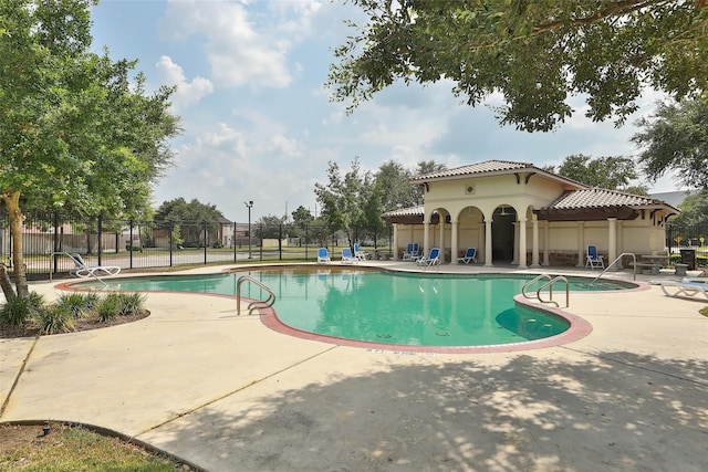 12931 Blackbrook Ln, Houston, TX 77041 - community pool with a patio and fence