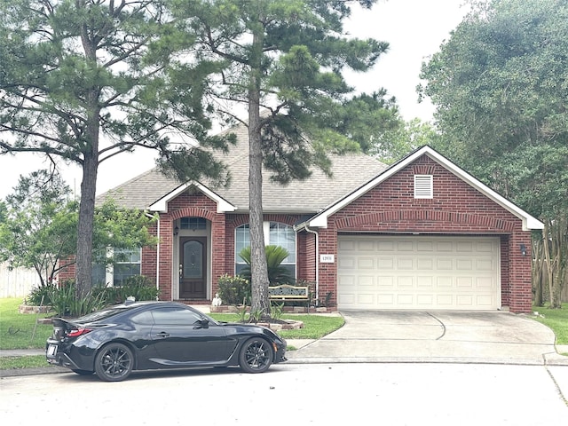 12931 Blackbrook Ln, Houston, TX 77041 - view of front of house featuring driveway, brick siding, a garage, and roof with shingles