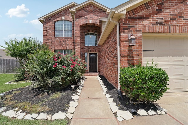 5023 Royal Arbor Ln, Houston, TX 77084 - view of front of house featuring an attached garage, brick siding, and fence