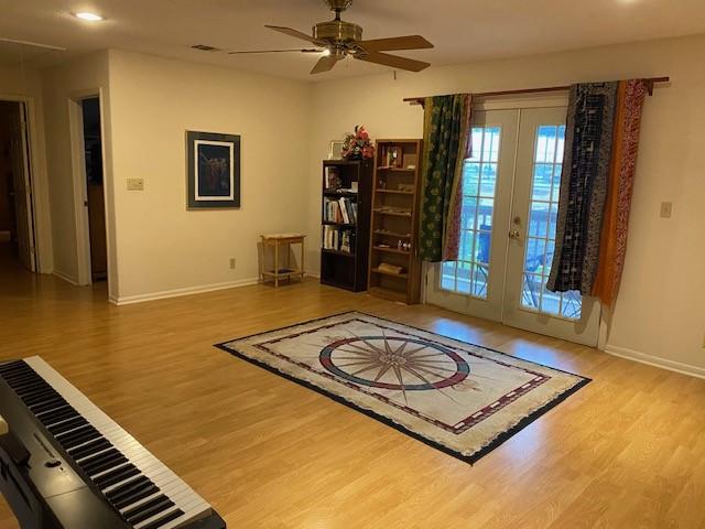 21626 Gentry Rd, Cypress, TX 77429 - foyer featuring wood finished floors, french doors, baseboards, and recessed lighting