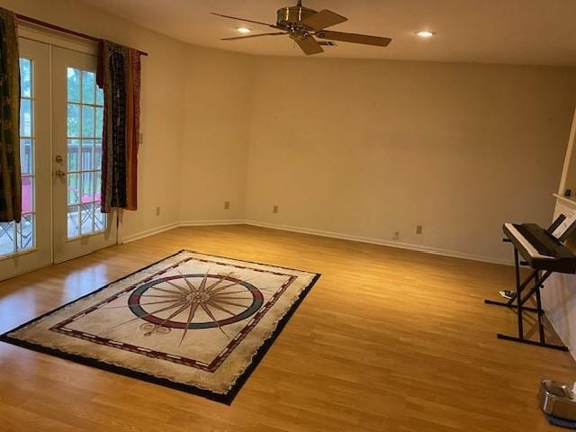 21626 Gentry Rd, Cypress, TX 77429 - empty room with french doors, wood finished floors, ceiling fan, baseboards, and recessed lighting