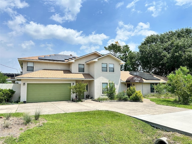 21626 Gentry Rd, Cypress, TX 77429 - traditional-style home with stucco siding, driveway, solar panels, a front yard, and a garage