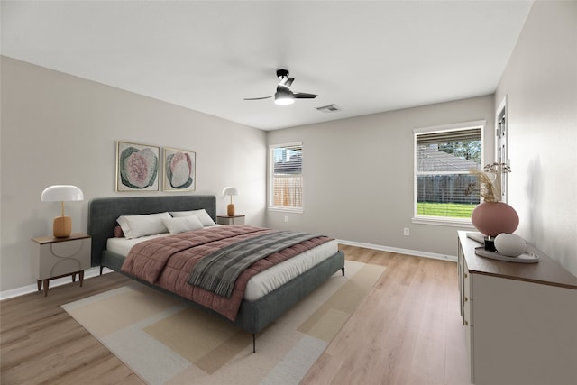 17027 Sperry Landing Dr, Houston, TX 77095 - bedroom featuring light wood-style flooring, baseboards, and a ceiling fan
