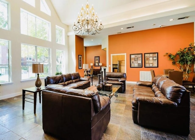 1330 Old Spanish Trl Unit 7207, Houston, TX 77054 - living room with a chandelier, baseboards, recessed lighting, a high ceiling, and stone tile floors