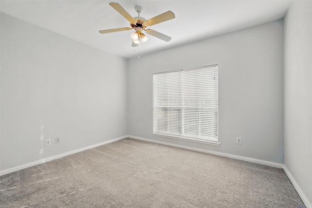 1330 Old Spanish Trl Unit 7207, Houston, TX 77054 - spare room featuring baseboards, light carpet, and ceiling fan