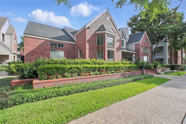 1330 Old Spanish Trl Unit 7207, Houston, TX 77054 - view of front of house featuring brick siding and roof with shingles