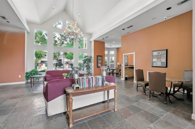 1330 Old Spanish Trl Unit 7207, Houston, TX 77054 - living area featuring high vaulted ceiling, a chandelier, stone tile flooring, and baseboards