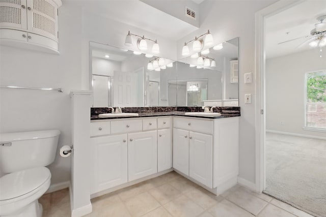 1330 Old Spanish Trl Unit 7207, Houston, TX 77054 - full bathroom with double vanity, baseboards, toilet, and a ceiling fan