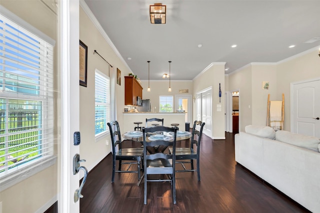 607 29th St, Dickinson, TX 77539 - dining room with dark wood-style flooring, ornamental molding, baseboards, and recessed lighting