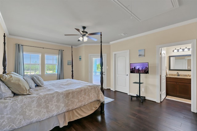 607 29th St, Dickinson, TX 77539 - bedroom featuring attic access, dark wood-type flooring, ornamental molding, access to outside, and a sink