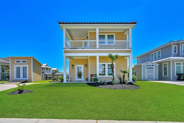 607 29th St, Dickinson, TX 77539 - view of front of home featuring a balcony, french doors, stucco siding, and a tile roof