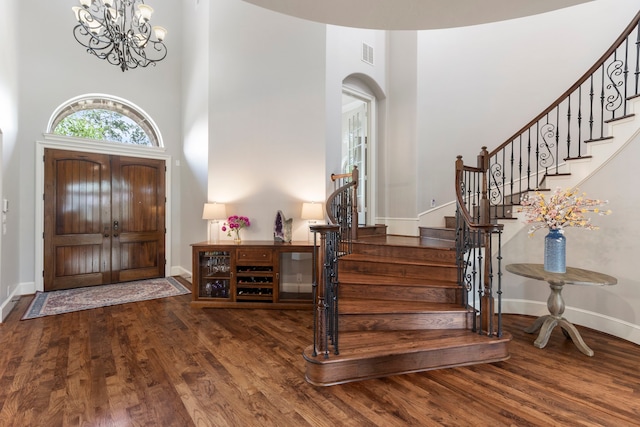 27433 S Lazy Meadow Way, Spring, TX 77386 - entrance foyer featuring a high ceiling, wood finished floors, stairway, baseboards, and a chandelier