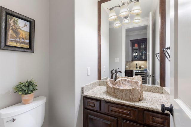 27433 S Lazy Meadow Way, Spring, TX 77386 - bathroom with toilet, a chandelier, vanity, and decorative backsplash