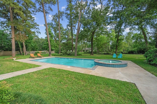 1710 Magnolia Ln, Kingwood, TX 77339 - view of pool with a lawn, view of wooded area, a patio, and a pool with connected hot tub
