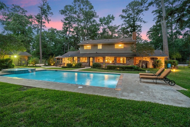 1710 Magnolia Ln, Kingwood, TX 77339 - view of pool featuring a patio and a pool with connected hot tub