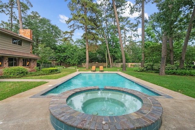 1710 Magnolia Ln, Kingwood, TX 77339 - view of pool featuring a pool with connected hot tub and view of scattered trees