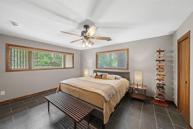 1710 Magnolia Ln, Kingwood, TX 77339 - bedroom with baseboards and ceiling fan