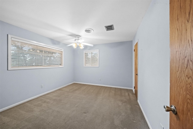 1710 Magnolia Ln, Kingwood, TX 77339 - carpeted empty room with a ceiling fan and baseboards