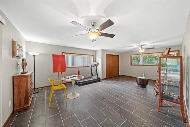 1710 Magnolia Ln, Kingwood, TX 77339 - sitting room with ceiling fan, baseboards, and a wall mounted air conditioner