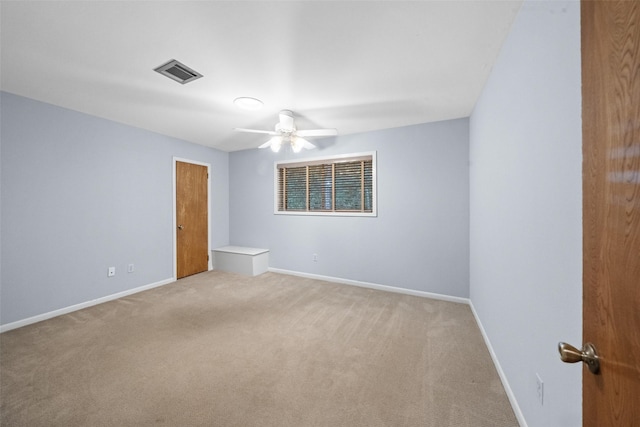 1710 Magnolia Ln, Kingwood, TX 77339 - empty room with light carpet, ceiling fan, and baseboards