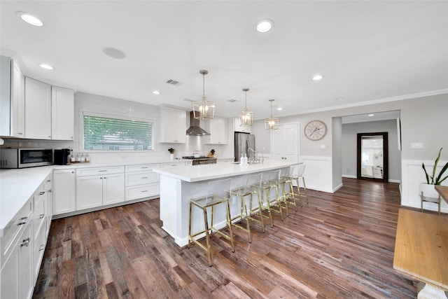 1345 Curtin St, Houston, TX 77018 - kitchen featuring wall chimney exhaust hood, appliances with stainless steel finishes, white cabinets, crown molding, and backsplash