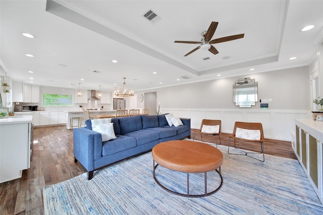 1345 Curtin St, Houston, TX 77018 - living area with wood finished floors, ornamental molding, ceiling fan, wainscoting, and a raised ceiling