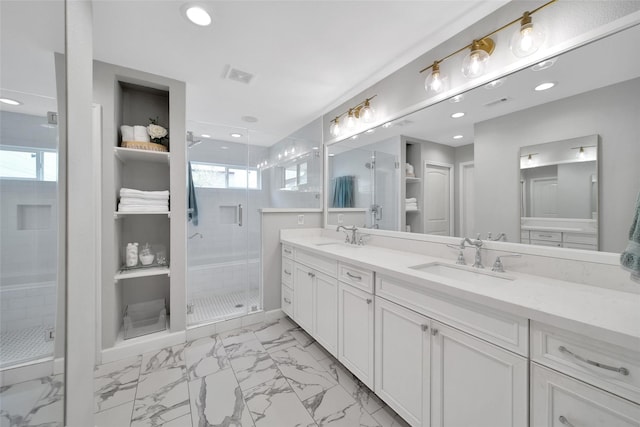 1345 Curtin St, Houston, TX 77018 - full bathroom with marble finish floors, a stall shower, double vanity, and recessed lighting