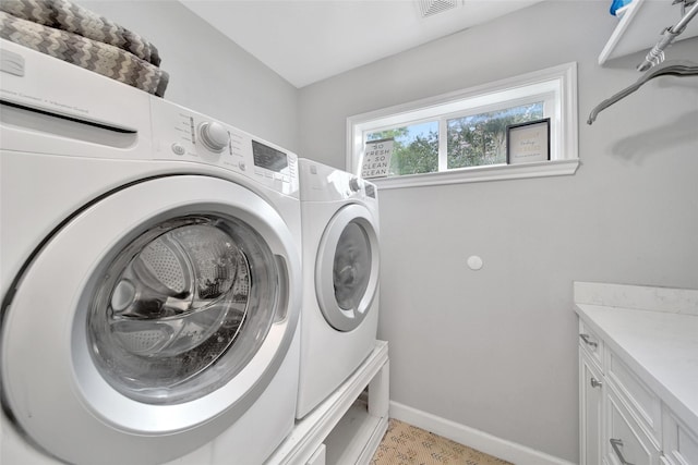 1345 Curtin St, Houston, TX 77018 - clothes washing area with independent washer and dryer, cabinet space, and baseboards