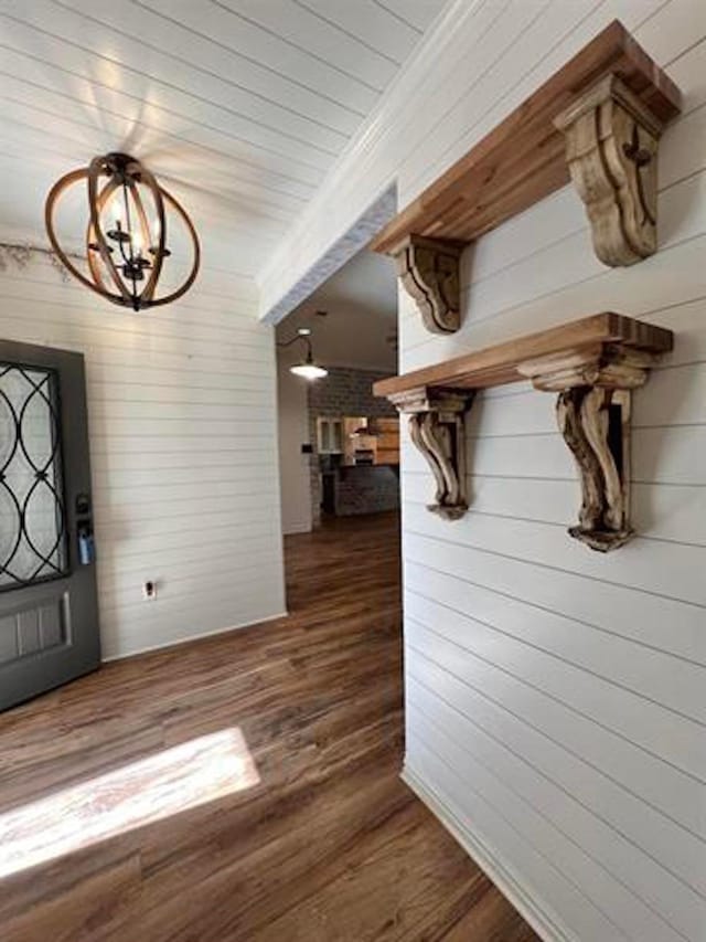 225 Lexington Dr, Vidor, TX 77662 - foyer featuring wood finished floors, wood walls, and a chandelier