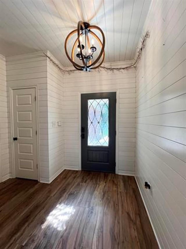 225 Lexington Dr, Vidor, TX 77662 - entryway featuring wood finished floors, baseboards, and wood walls