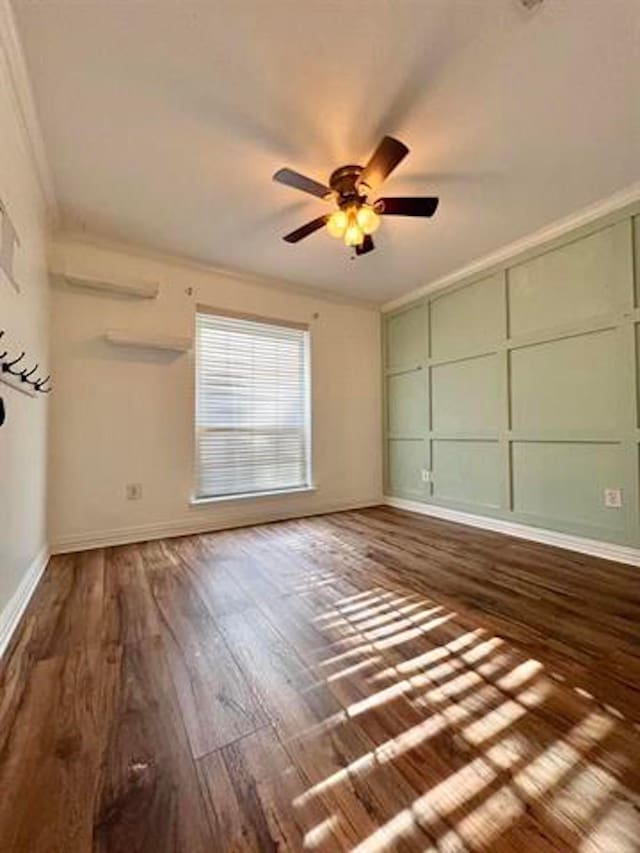 225 Lexington Dr, Vidor, TX 77662 - spare room with wood finished floors, baseboards, a ceiling fan, and crown molding