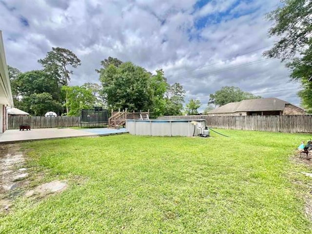 225 Lexington Dr, Vidor, TX 77662 - view of yard with a trampoline
