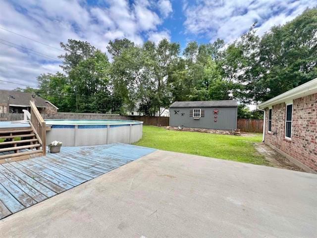 225 Lexington Dr, Vidor, TX 77662 - view of swimming pool with a deck and an outbuilding