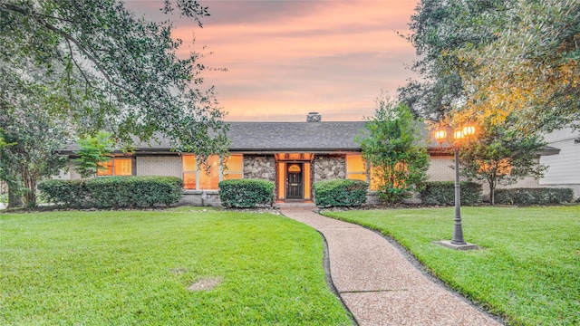4438 Wigton Dr, Houston, TX 77096 - mid-century modern home with a front lawn, brick siding, and a shingled roof