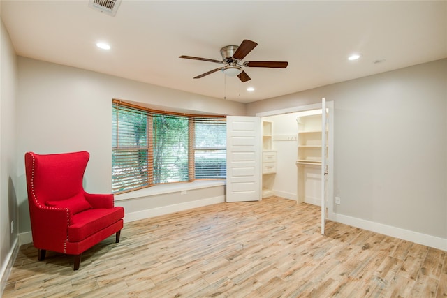 4438 Wigton Dr, Houston, TX 77096 - sitting room featuring a ceiling fan, wood finished floors, baseboards, and recessed lighting