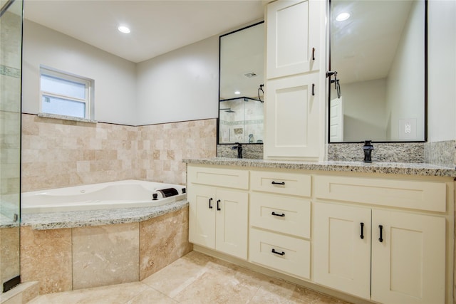 4438 Wigton Dr, Houston, TX 77096 - bathroom featuring a bath, tiled shower, and double vanity