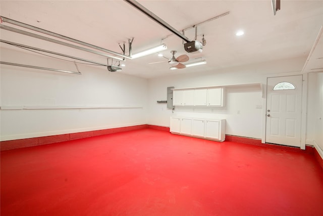 4438 Wigton Dr, Houston, TX 77096 - garage featuring a garage door opener, baseboards, electric panel, and recessed lighting