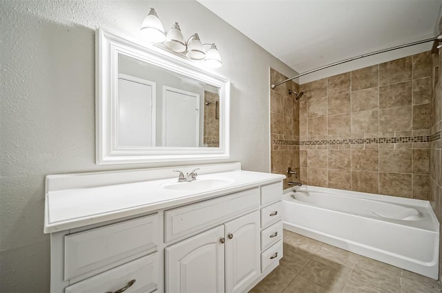 4747 Nasa Pkwy Unit 104, Pasadena, TX 77586 - full bath featuring shower / tub combination, vanity, tile patterned floors, and a textured wall