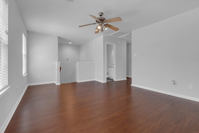 7918 Swan Ln, Baytown, TX 77523 - unfurnished room featuring ceiling fan, dark wood-type flooring, baseboards, and attic access